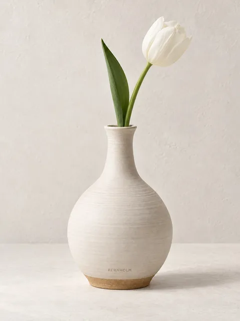Ceramic bud vase — a single tulip, AI photo made with Pixo Studio