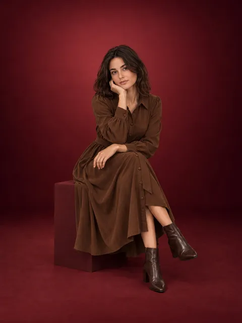 Shirt dress — seated, AI photo made with Pixo Studio