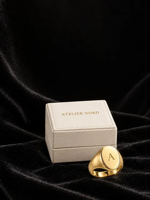 Gold signet ring — space for text, AI photo made with Pixo Studio