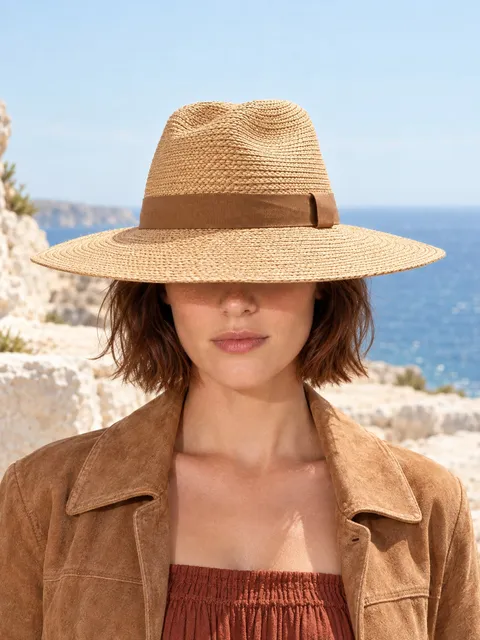 Straw sun hat — worn, from the front, AI photo made with Pixo Studio